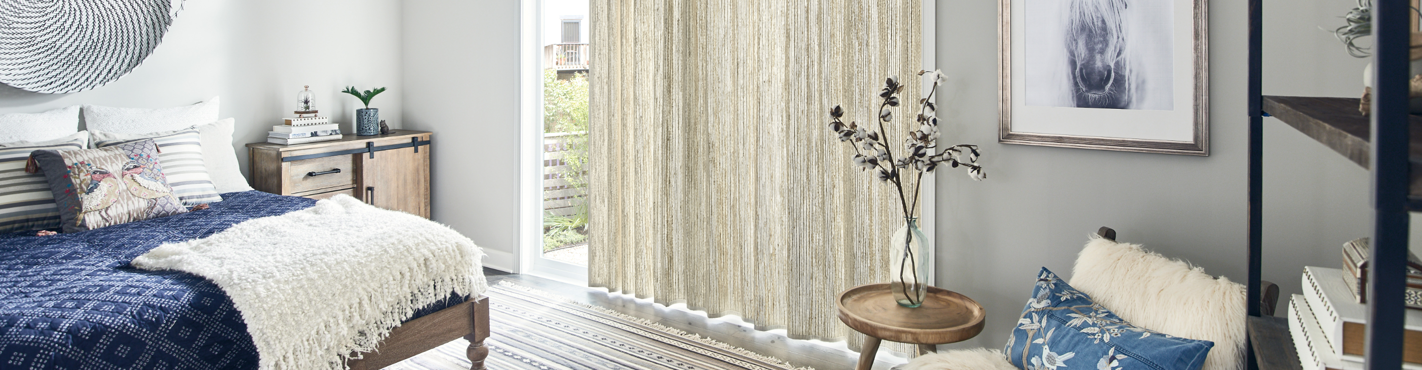 Long neutral drapes in a bedroom. 